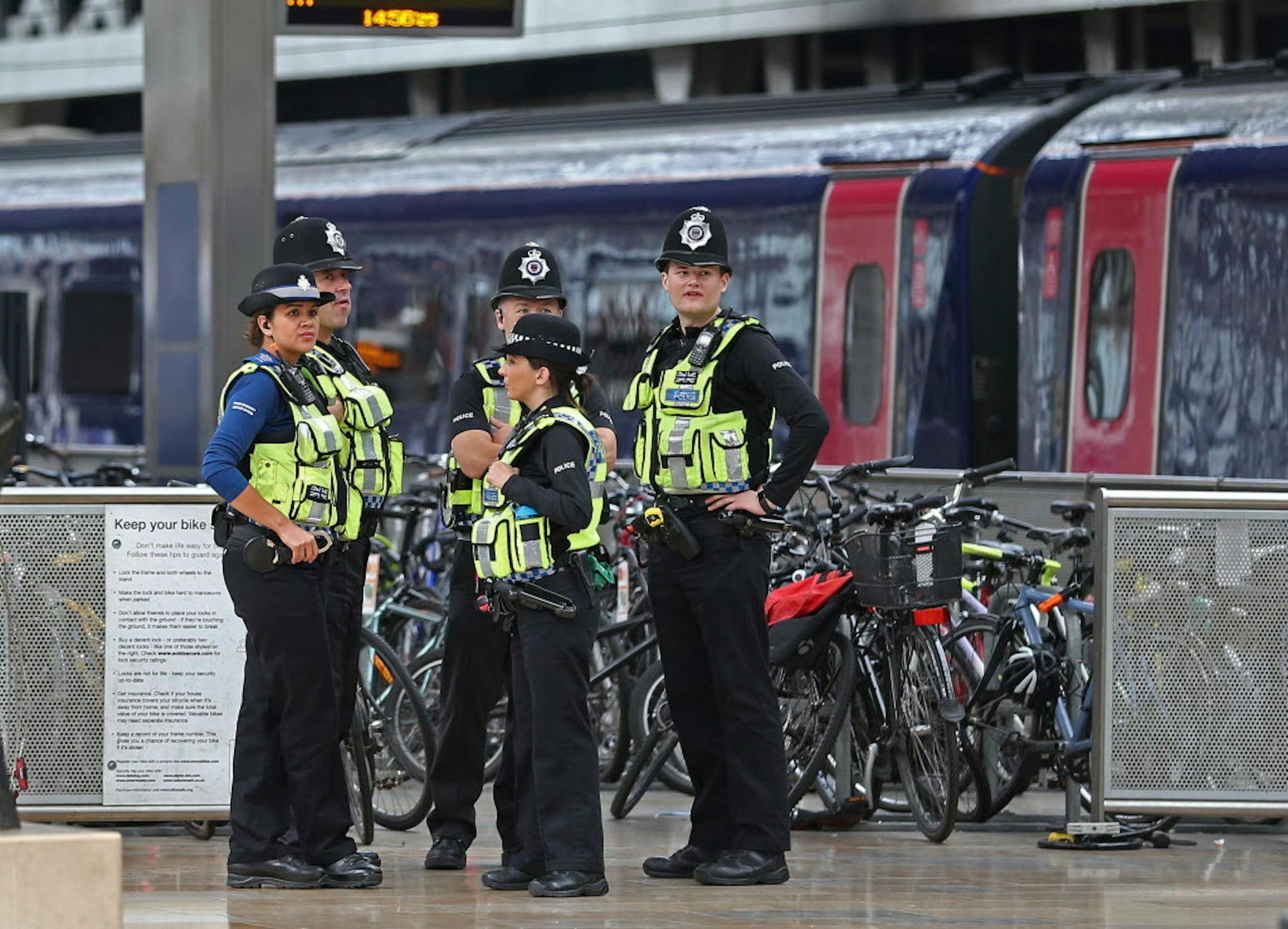 Police provide security at Paddington mainline train station in London, after a terrorist incident was declared at nearby Parsons Green subway station Friday, Sept. 15, 2017. A bucket wrapped in an insulated bag caught fire on a packed London subway train early Friday, sending commuters running for safety at the height of the morning rush hour. (Andrew Matthews/PA via AP)