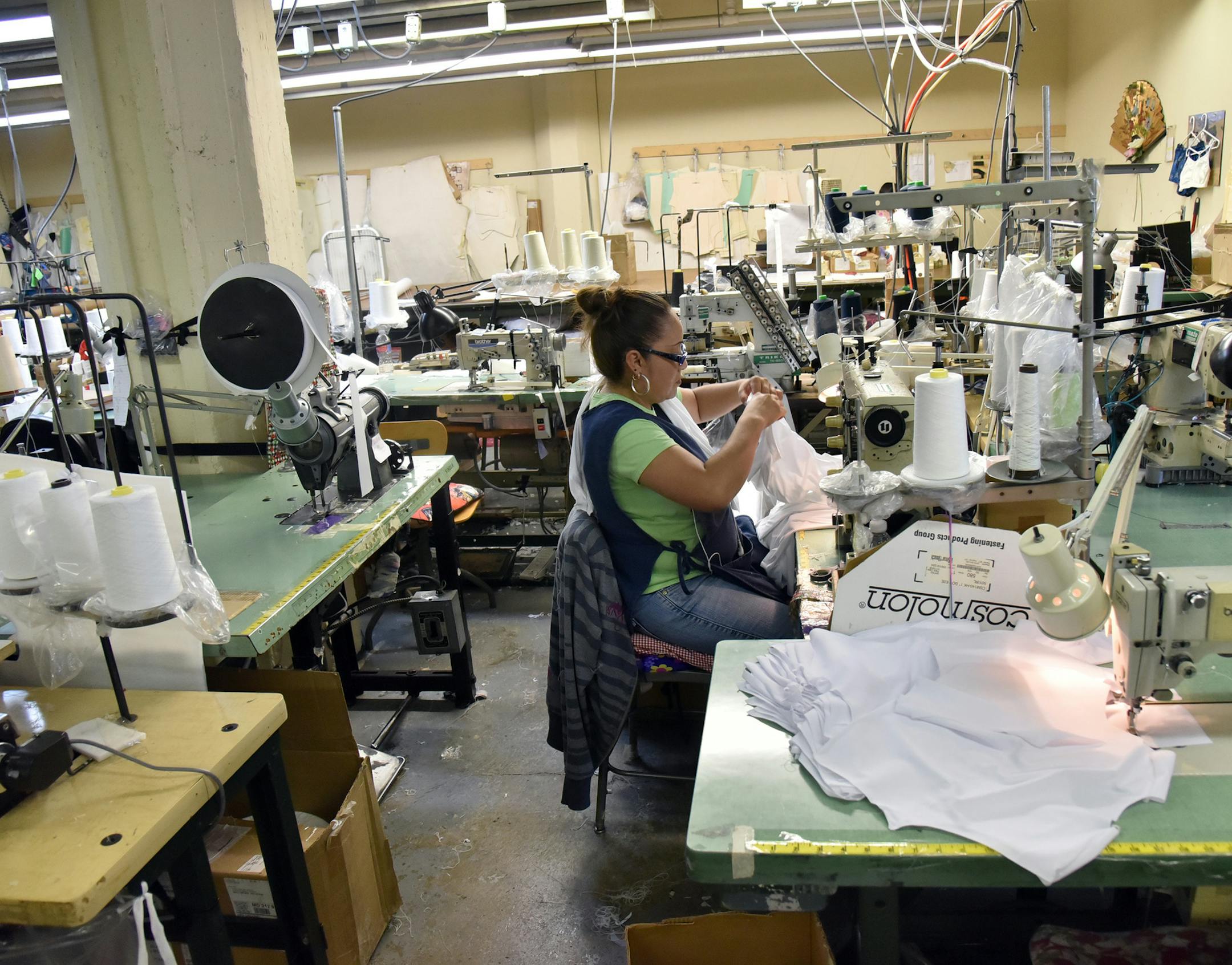 Mariana Caltempa, sewing machine operator, works on a transgender top at Fashions Unlimited, a nearly 40-year-old contract apparel manufacturer started and based in Baltimore, on Sept. 2, 2015. (Kim Hairston/Baltimore Sun/TNS) ORG XMIT: 1173776