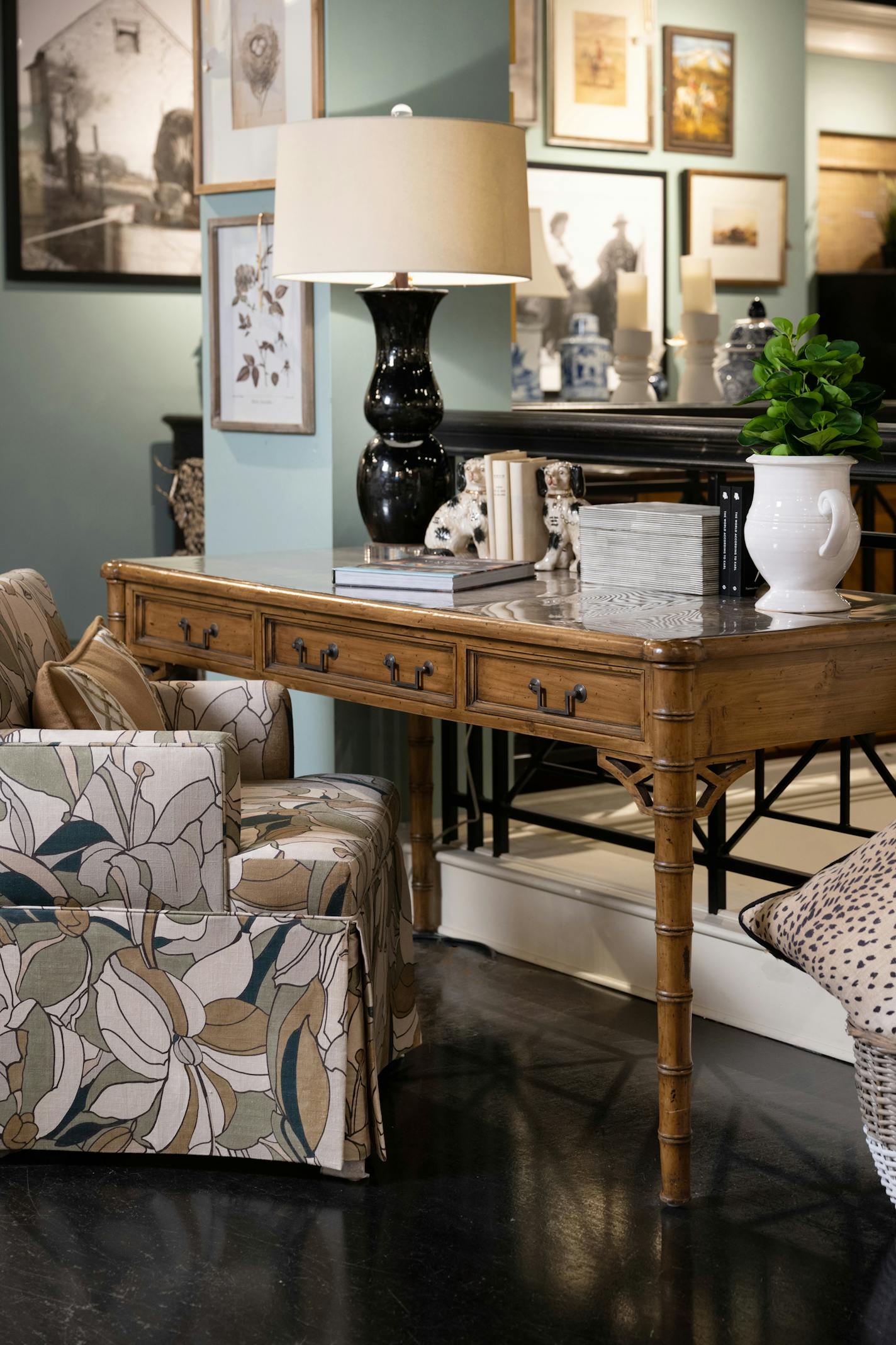 A desk steals the spotlight with its exquisite chippendale side panel, accentuated by acrylic pulls with brass accents. (Handout/TNS)