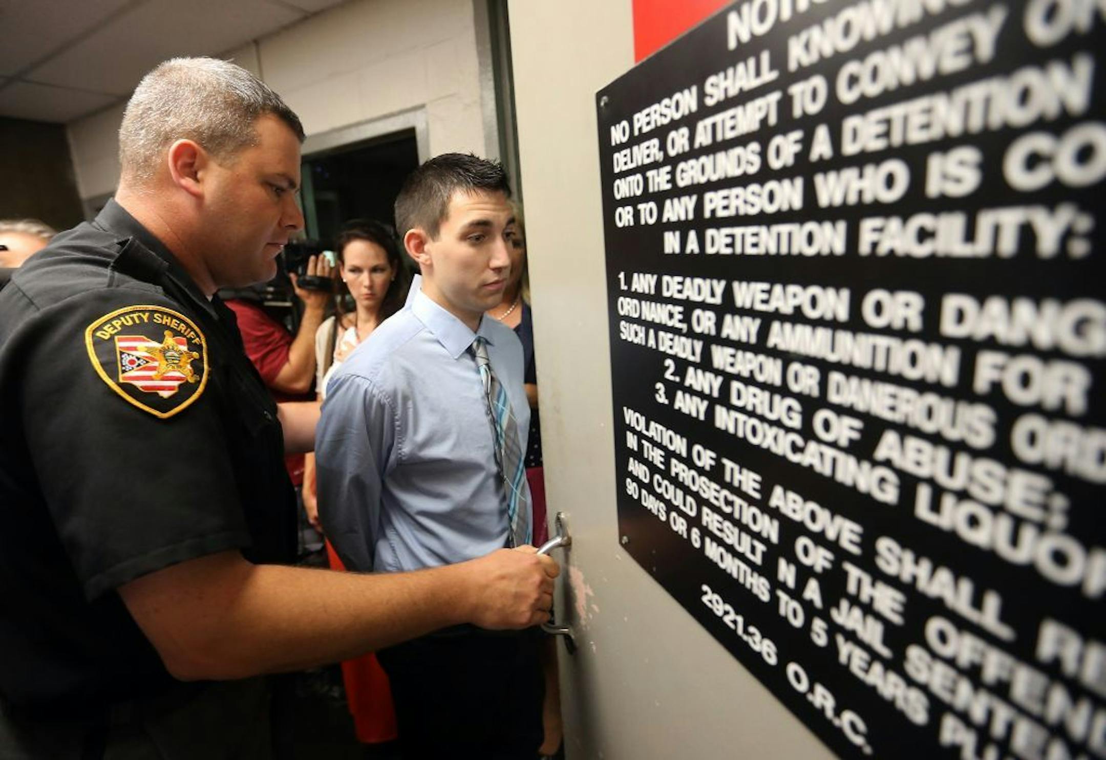 After confessing on video to killing a man in a drunk-driving accident, Matthew Cordle, 22, right, surrenders to sheriff's deputies at the Franklin County Corrections Center in Columbus, Ohio, Monday, Sept. 9, 2013.