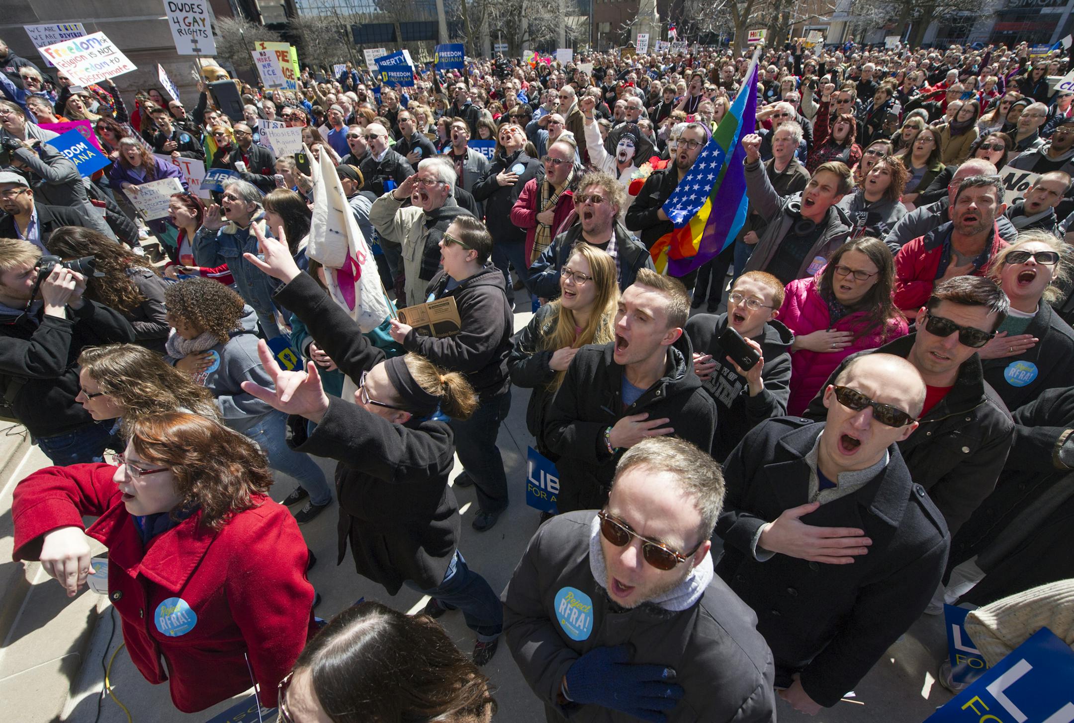 Thousands of opponents of Indiana Senate Bill 101, the Religious Freedom Restoration Act, gathered on the lawn of the Indiana State House to rally against that legislation Saturday, March 28, 2015. Indiana's law has been widely criticized by businesses and organizations around the country. (AP Photo/Doug McSchooler)