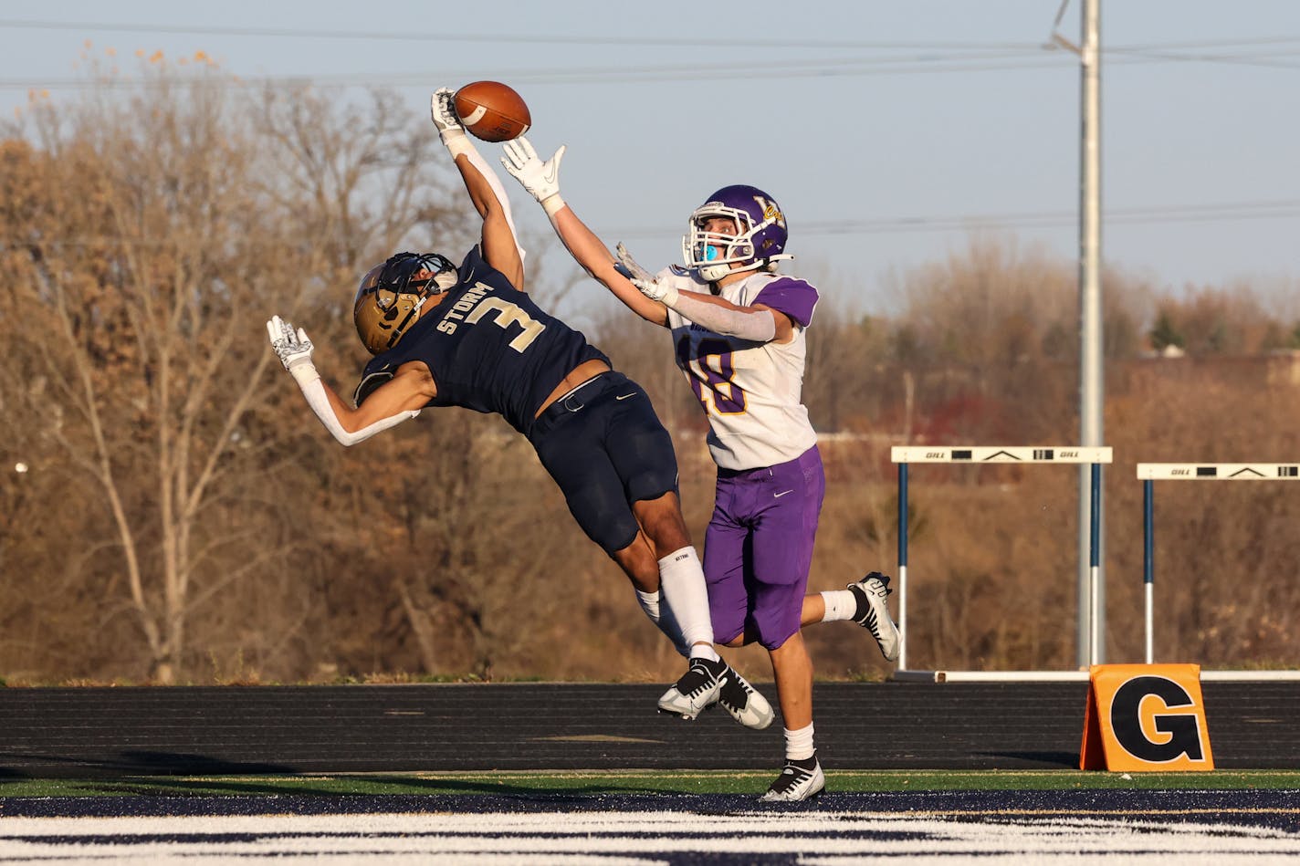 Chanhassen's Maxwell Woods (3) breaks up a pass in the end zone to Waconia's Mason Bach (18). Photo by Cheryl A. Myers, SportsEngine