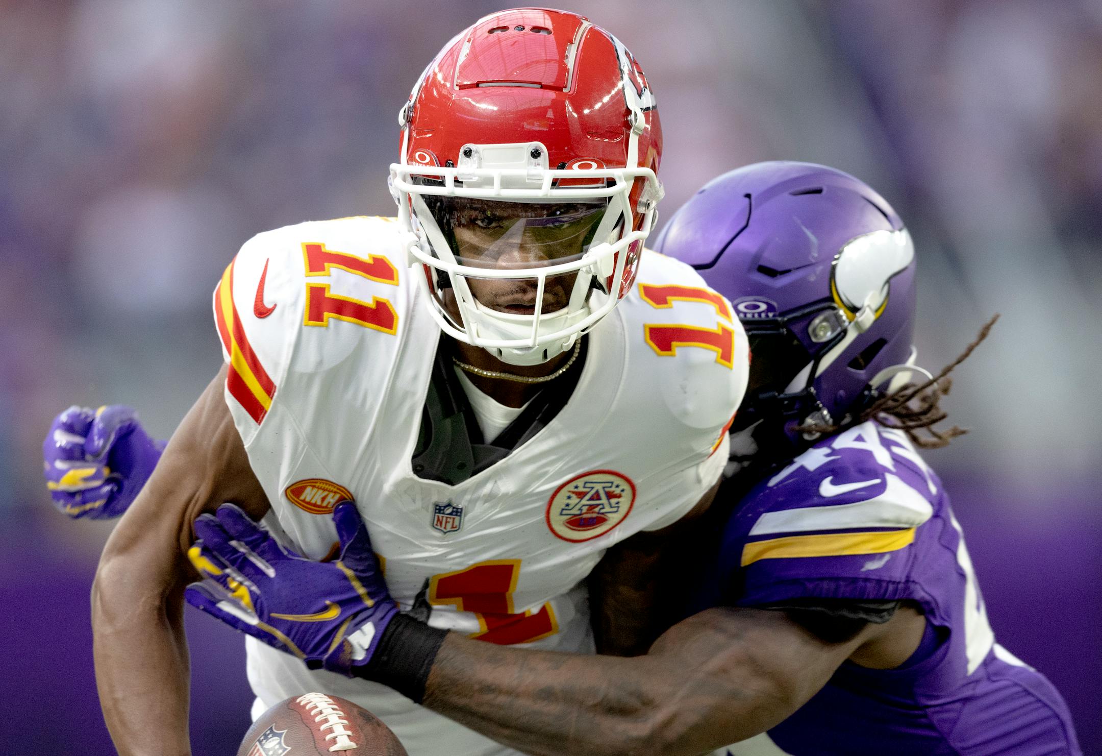 Marquez Valdes-Scantling (11) of the Kansas City Chiefs is tackled by Minnesota Vikings linebacker Josh Metellus (44) in the third quarter.