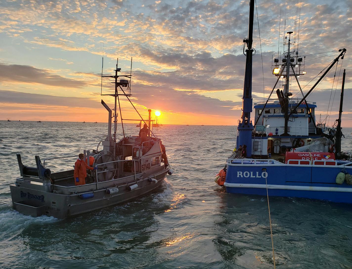 Provided by Tom Rogotzke Jay Rogotzke's boat, Rip Runner, pulls up to a tender boat, which carries supplies to fishing boats or helps them unload their catch.