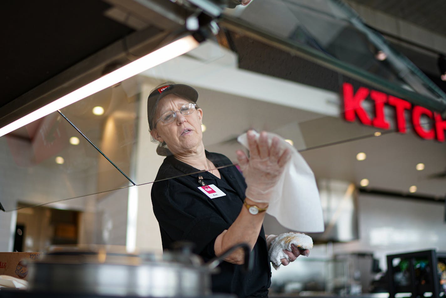 Kim Radman sanitized the salad and soup bars at Cub Foods in Minneapolis on March 11.