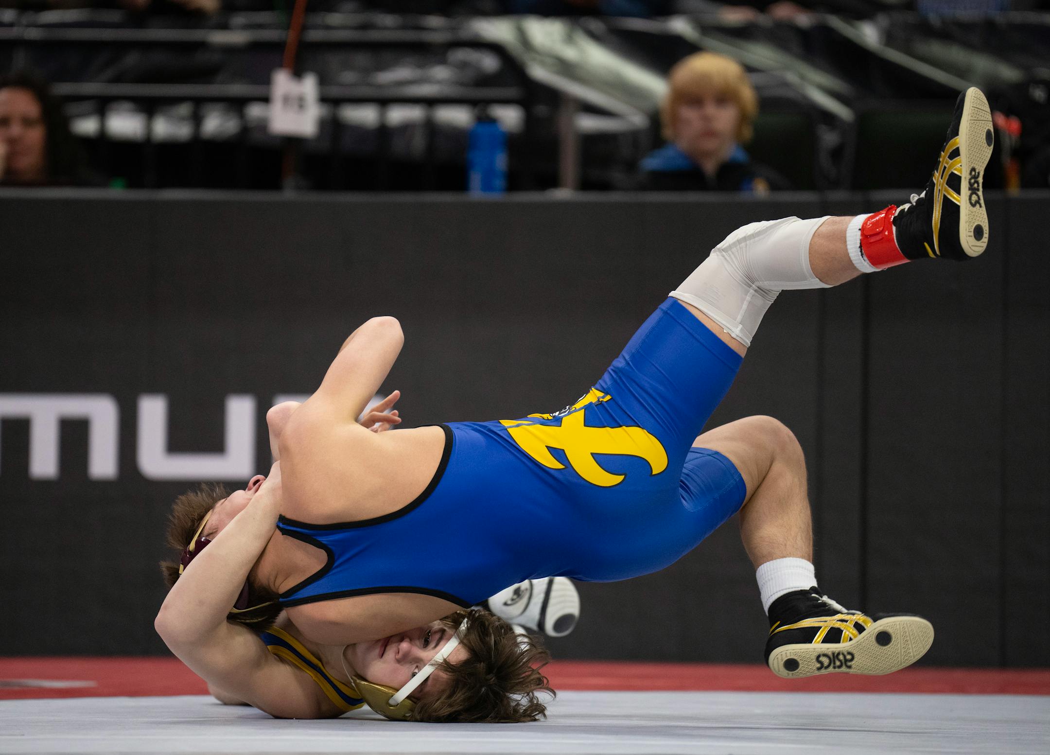 Blake Beissel of Hastings, top, on his way to a 3-0 decision over Chase Mills of St. Michael-Albertville in their 113 lb. match.