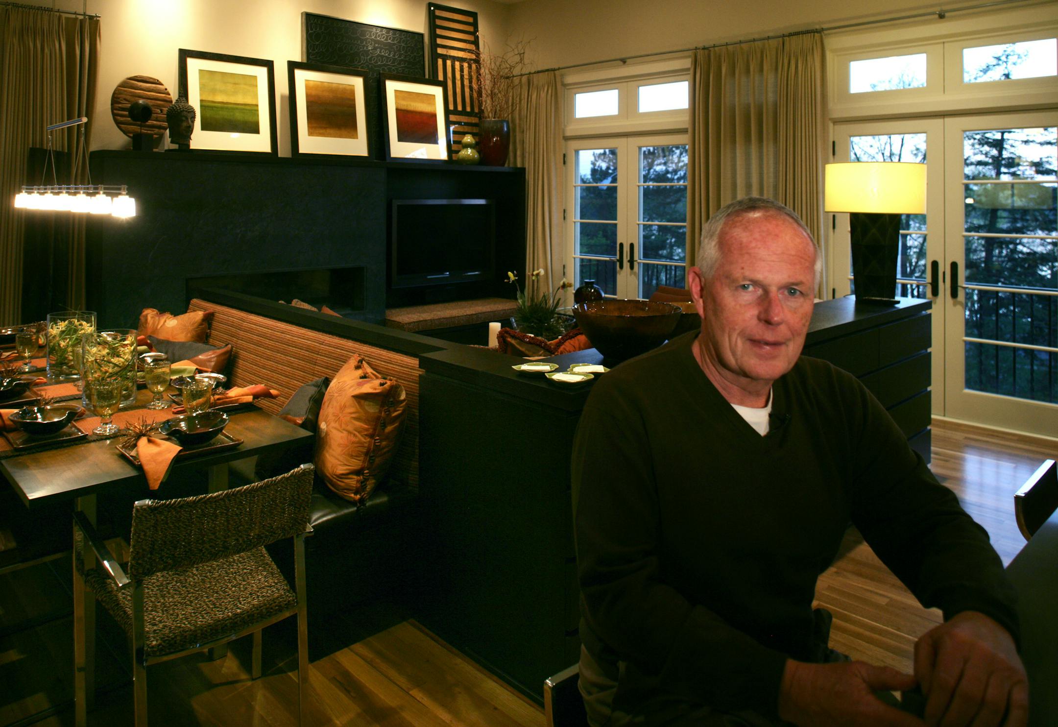 Advertising icon Pat Fallon sits in the great room of his Lake Harriet Colonial.