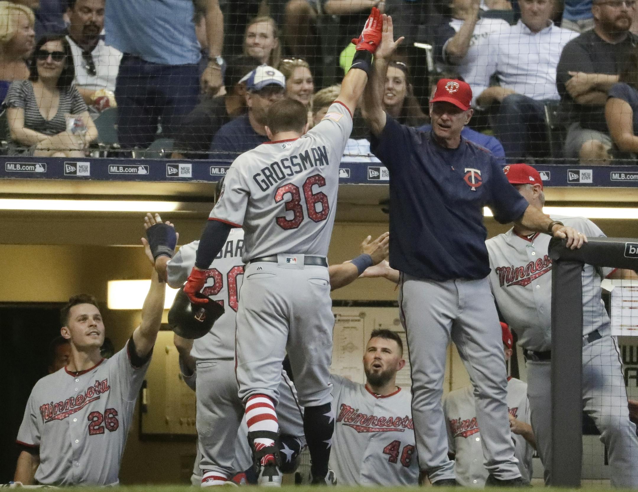 Minnesota Twins' Robbie Grossman celebrates his grand slam during the fifth inning of a baseball game against the Milwaukee Brewers Monday, July 2, 2018, in Milwaukee. (AP Photo/Morry Gash)