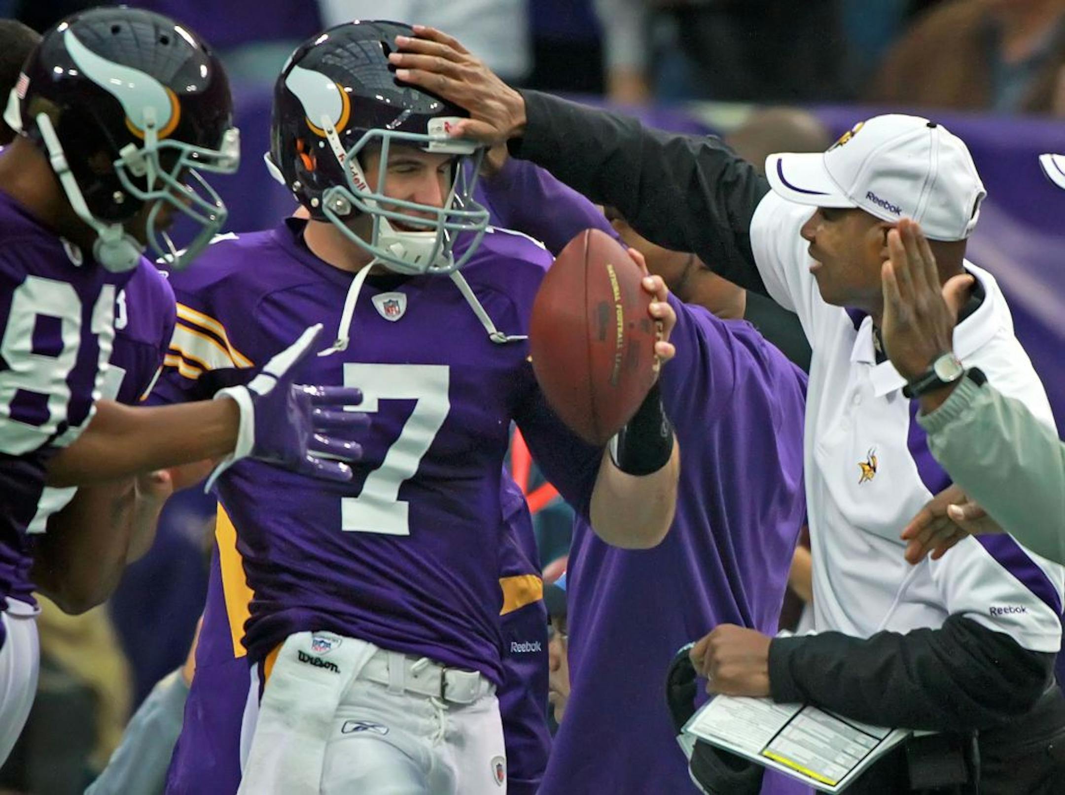 Vikings head coach Leslie Frazier congratulated Christian Ponder after he completed a 2-yard touchdown pass to Visanthe Shiancoe in the first quarter. The Green Bay Packers defeated the Minnesota Vikings, 33-27, at Mall of America Field in Minneapolis, Minnesota, on Sunday, October 23, 2011.