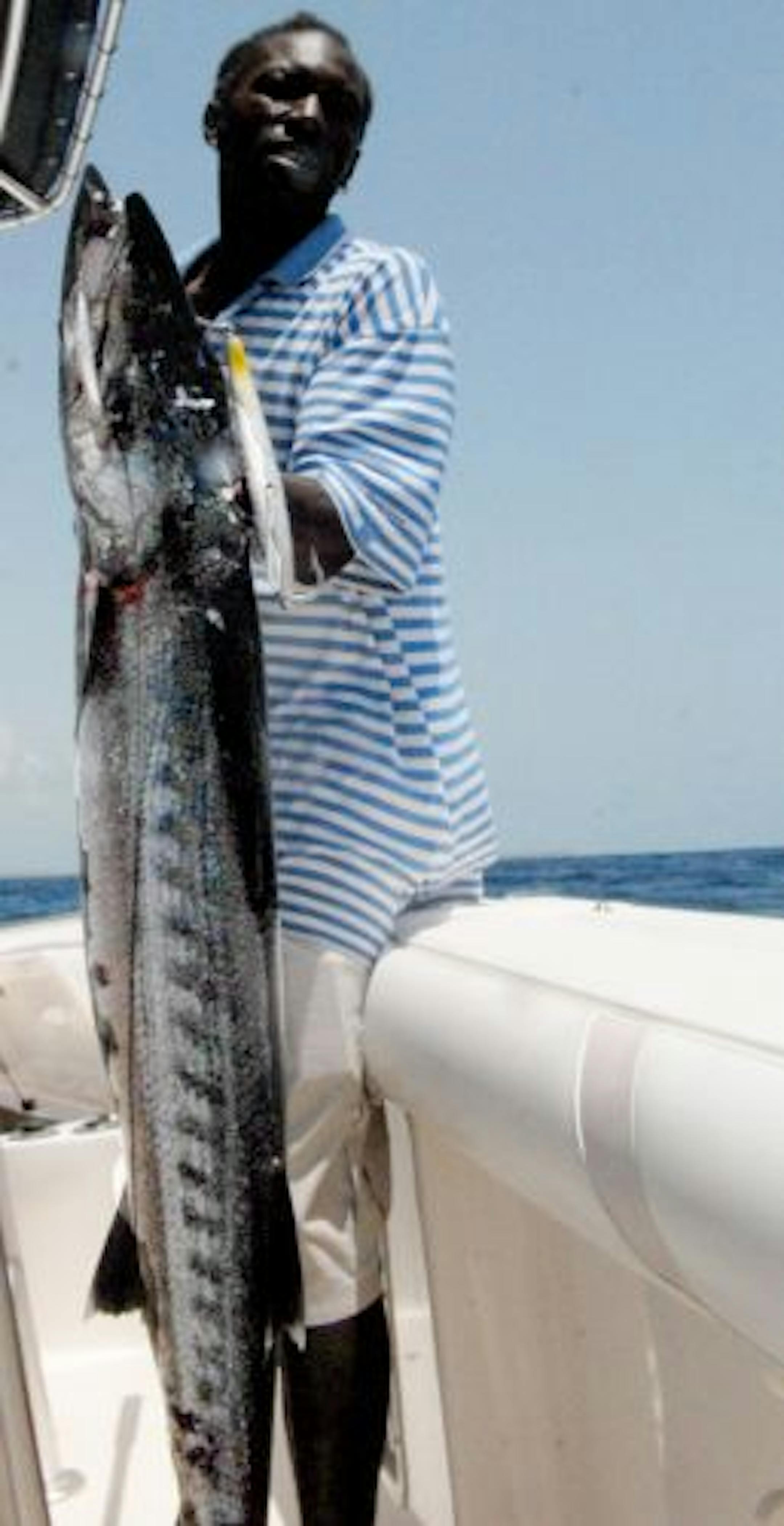 Louie the Boat Driver (his actual name is Winston Nicholas) with a barracuda that is prized as an eating fish by some residents of Antigua.