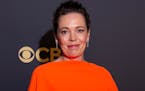 Olivia Colman posed for photographers as she arrives for the Netflix Celebration of the 73rd Primetime Emmy Awards in central London, Sunday, Sept. 19