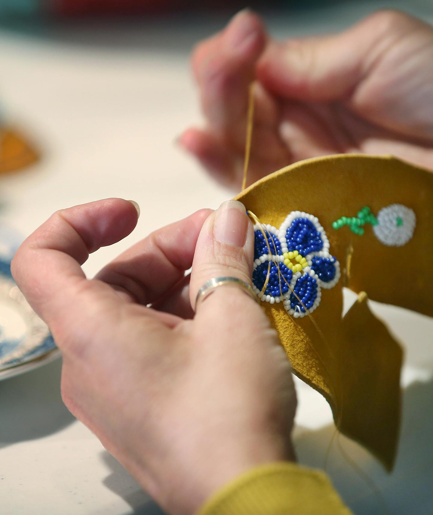 A woman worked on making moccasins at the American Indian Cultural Center. ] (ELIZABETH FLORES/STAR TRIBUNE) ELIZABETH FLORES &#x2022; eflores@startribune.com