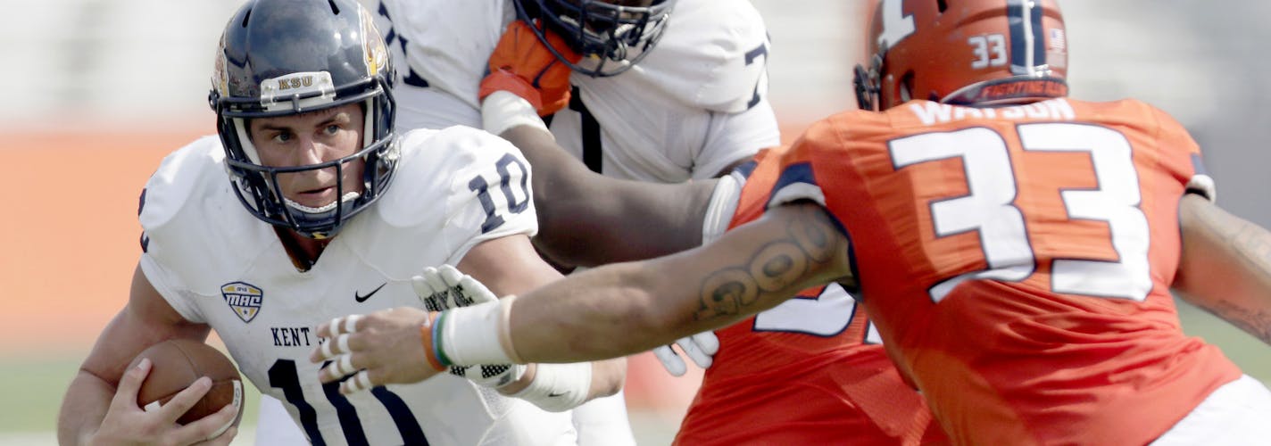 Kent State quarterback Colin Reardon (10) keeps the ball under pressure from Illinois linebacker Tre Watson (33) during the second half of an NCAA college football game Saturday, Sept. 5, 2015, in Champaign, Ill. Illinois won the game 52-3. (AP Photo/ Stephen Haas) ORG XMIT: ILSH126