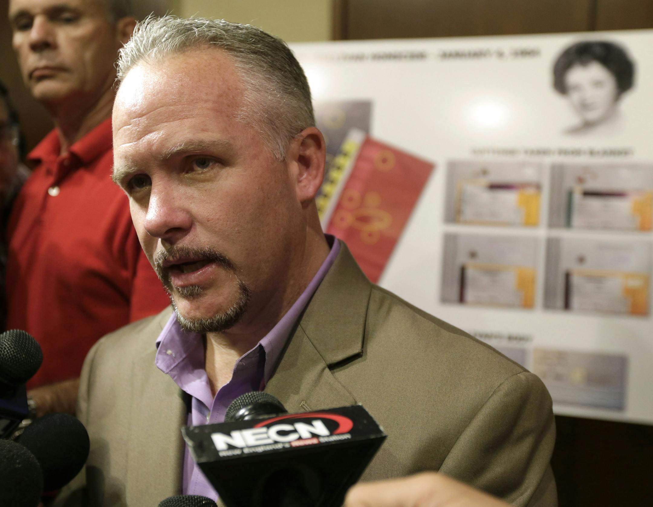 Casey Sherman, nephew of homicide victim Mary Sullivan, faces reporters during a news conference at Boston Police headquarters, Thursday, July 11, 2013. Investigators helped by advances in DNA technology finally have forensic evidence linking longtime suspect Albert DeSalvo to Sullivan, the last of the 1960s slayings attributed to the Boston†Strangler. A likeness of Sullivan appears on a chart behind right. (AP Photo/Steven Senne)