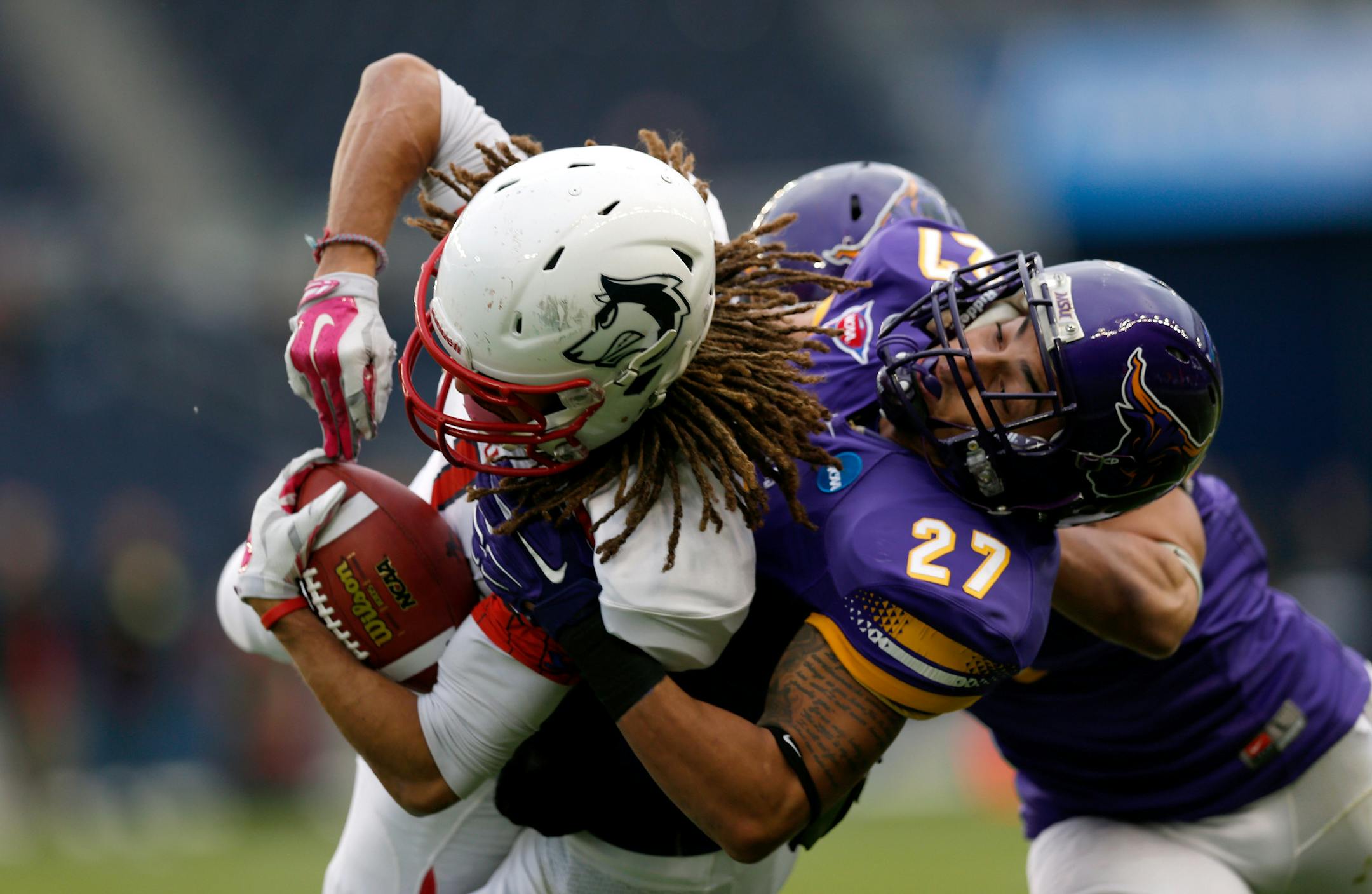 Rob Myers (27) of the Minnesota State Mankato Mavericks tackles Kieren Duncan (1) of the Colorado State Pueblo Thunderwolves during the first half of the NCAA-DII 2014 college football championship game Saturday, Dec. 20, 2014, in Kansas City, Kan. (AP Photo/The Kansas City Star, Brian Davidson)