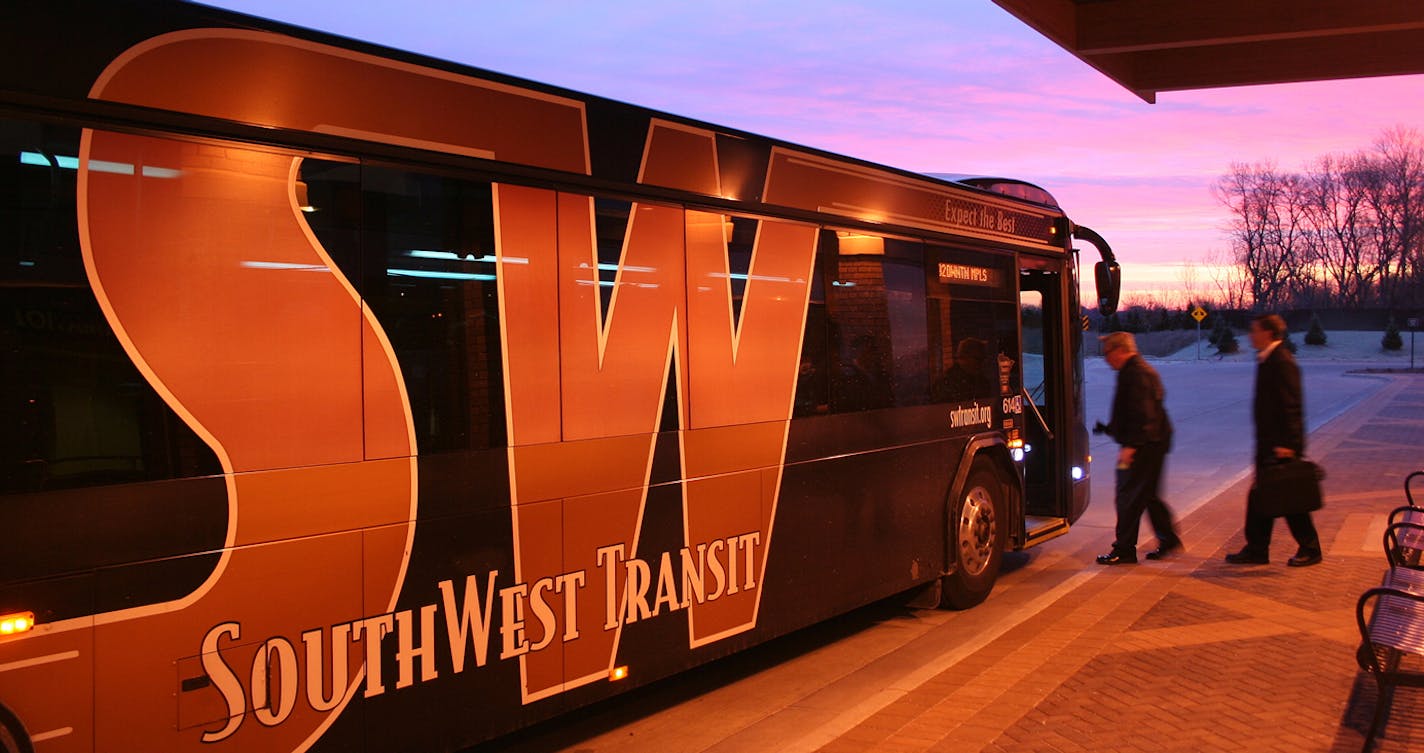 Riders board a SouthWest Transit bus.