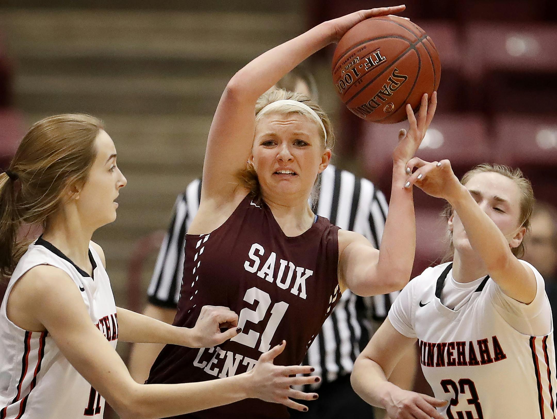 Tori Peschel (21) of Sauk Centre was defended by Kate Pryor (11) and Terra Rhoades (23) of Minnehaha Academy in the first half. ] CARLOS GONZALEZ • cgonzalez@startribune.com - March 15, 2017, Minneapolis, MN, Mariucci Arena, girls high school prep basketball, quarterfinal game, Class 2A quarterfinals, Minnehaha Academy vs. Sauk Centre
