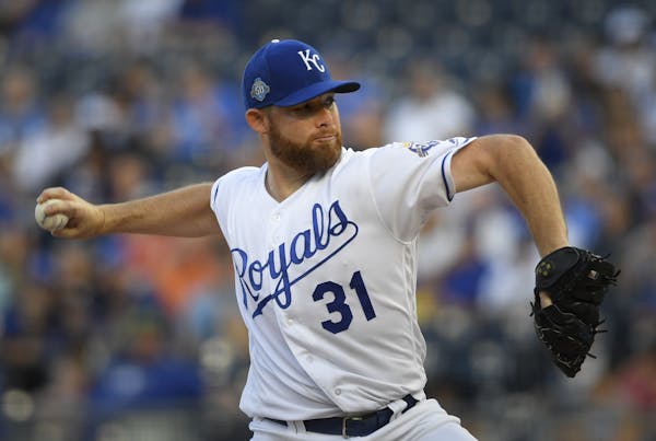 Kansas City Royals starting pitcher Ian Kennedy throws during the first inning of a baseball game against the Minnesota Twins in Kansas City, Mo., Sat