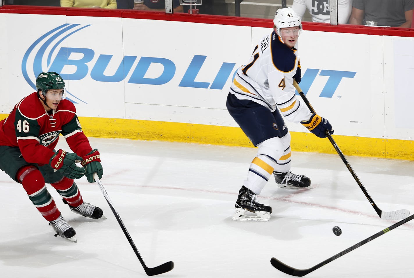 Jack Eichel (41) of the Buffalo Sabres and Jared Spurgeon (46) of the Minnesota Wild chased a loose puck in the second period. ] CARLOS GONZALEZ &#xef; cgonzalez@startribune.com - September 21, 2015, St. Paul, MN, Xcel Energy Center, NHL, Minnesota Wild vs. Buffalo Sabres