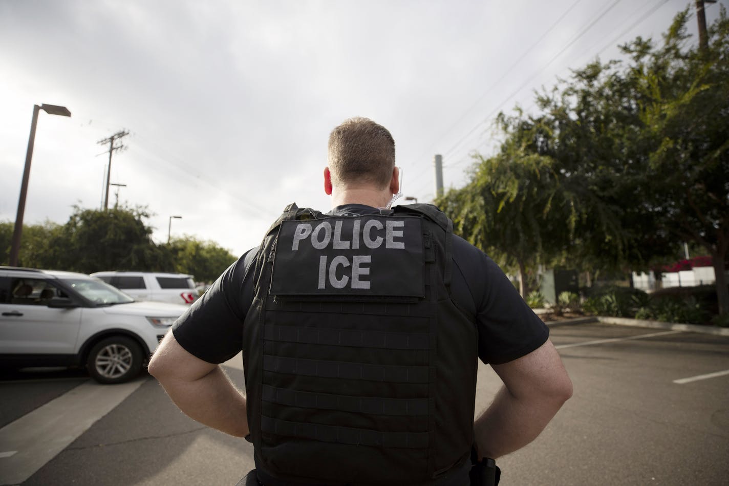 A U.S. Immigration and Customs Enforcement officer during a 2018 operation in Escondido, Calif.