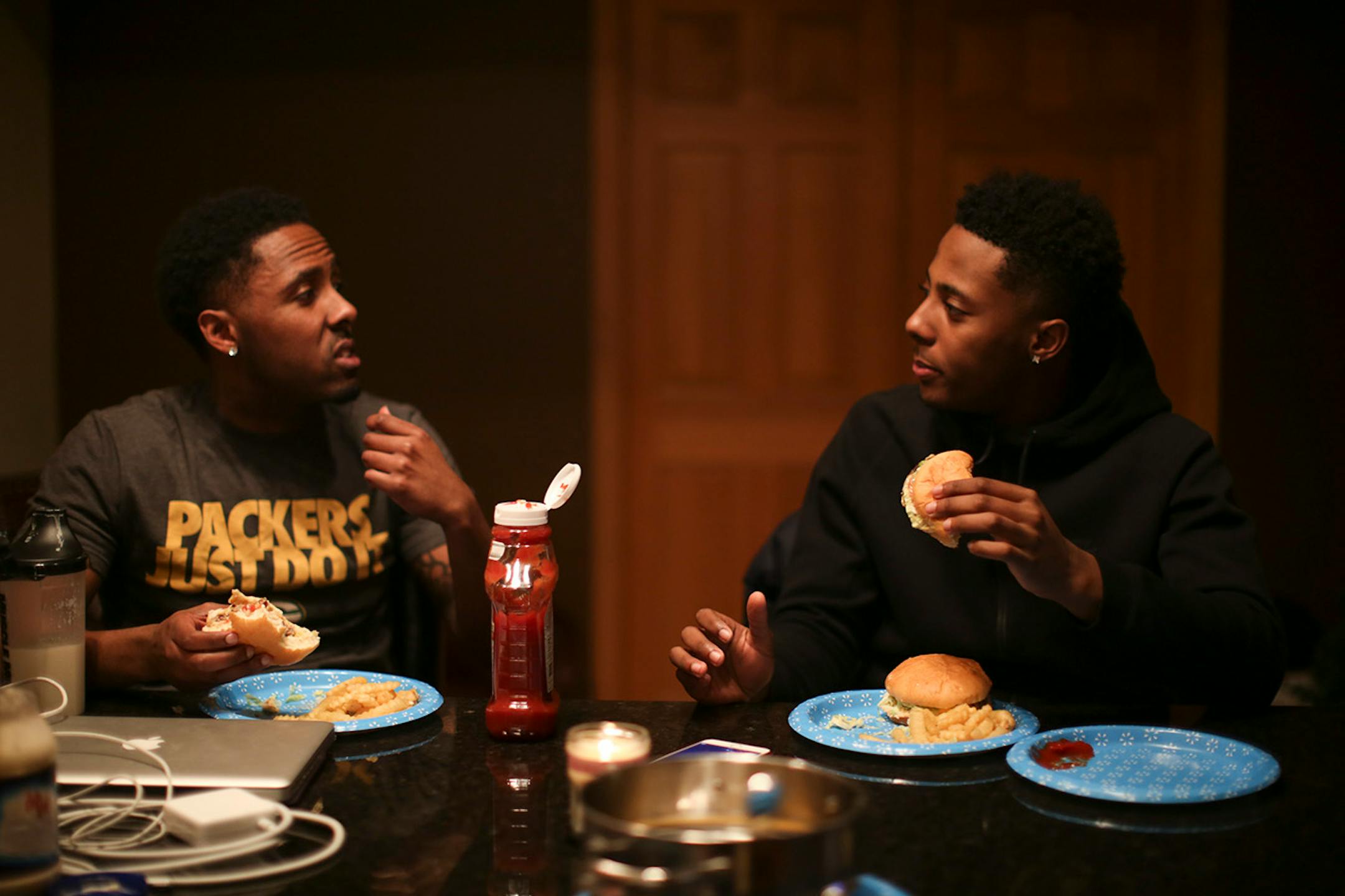 Jarvis Johnson and his older brother, Ty, left, eating dinner in their family's Brooklyn Park home. ] JEFF WHEELER • jeff.wheeler@startribune.com Jarvis Johnson, the DeLaSalle player who is the state's top basketball recruit, should be dead. His heart stopped for 12 minutes at the beginning of a practice when he was an eighth grader. Now with a defibrillator implanted in his chest, he's committed to the University of Minnesota. He was photographed at his family's Brooklyn Park home Thursday even