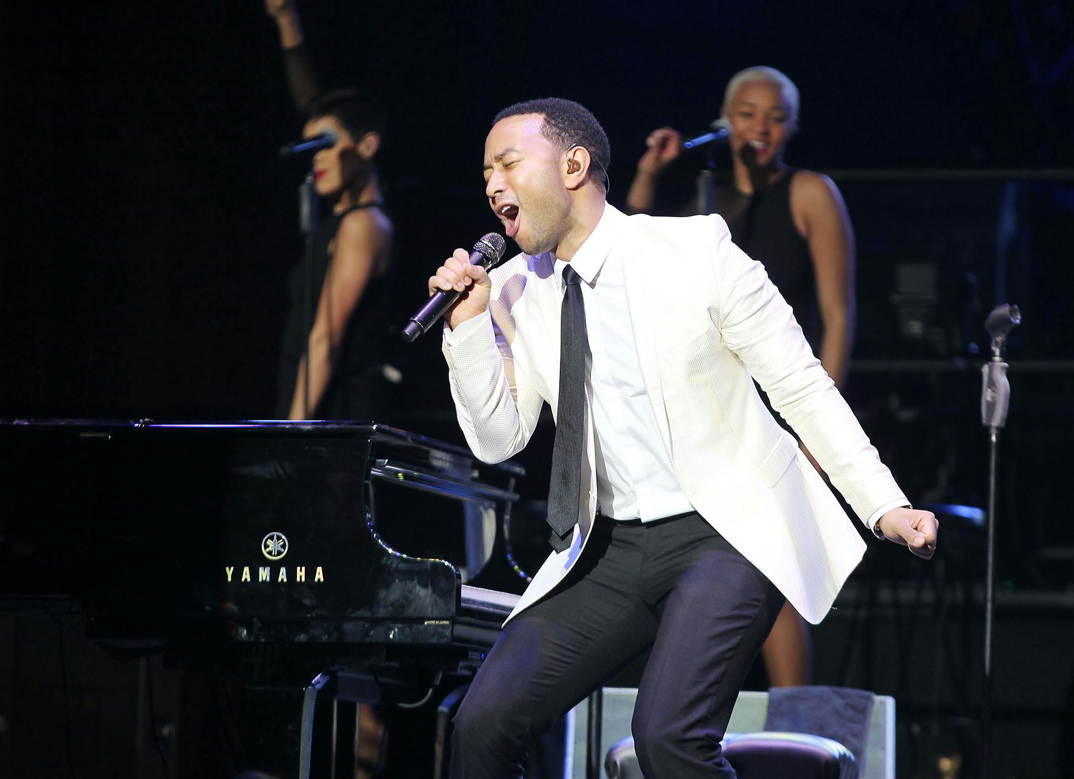 This image released by Starpix shows John Legend performing at the Shape Magazine and Men's Fitness Super Bowl Party at Cipriani 42nd Street on Friday, Jan. 31, 2014, in New York. (AP Photo/Starpix, Dave Allocca)