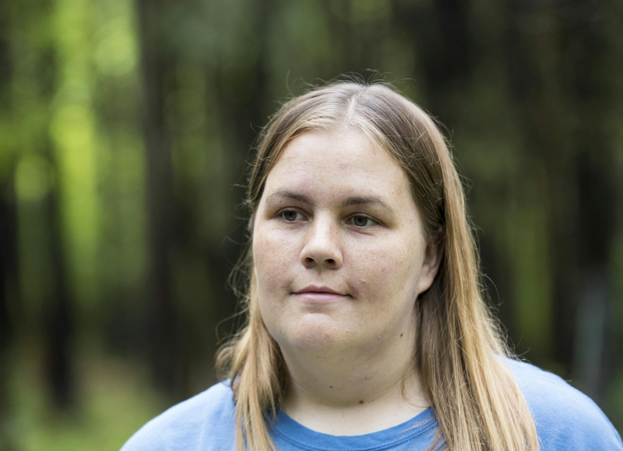 Chelsey Bahe used a tree stump to layout an image of a cat out of grass, sticks, bark and other tidbits she found in nature on a walk at Westwood Hills Nature Center in St. Louis Park, Minn., on August 30, 2016. ] RENEE JONES SCHNEIDER • renee.jones@startribune.com