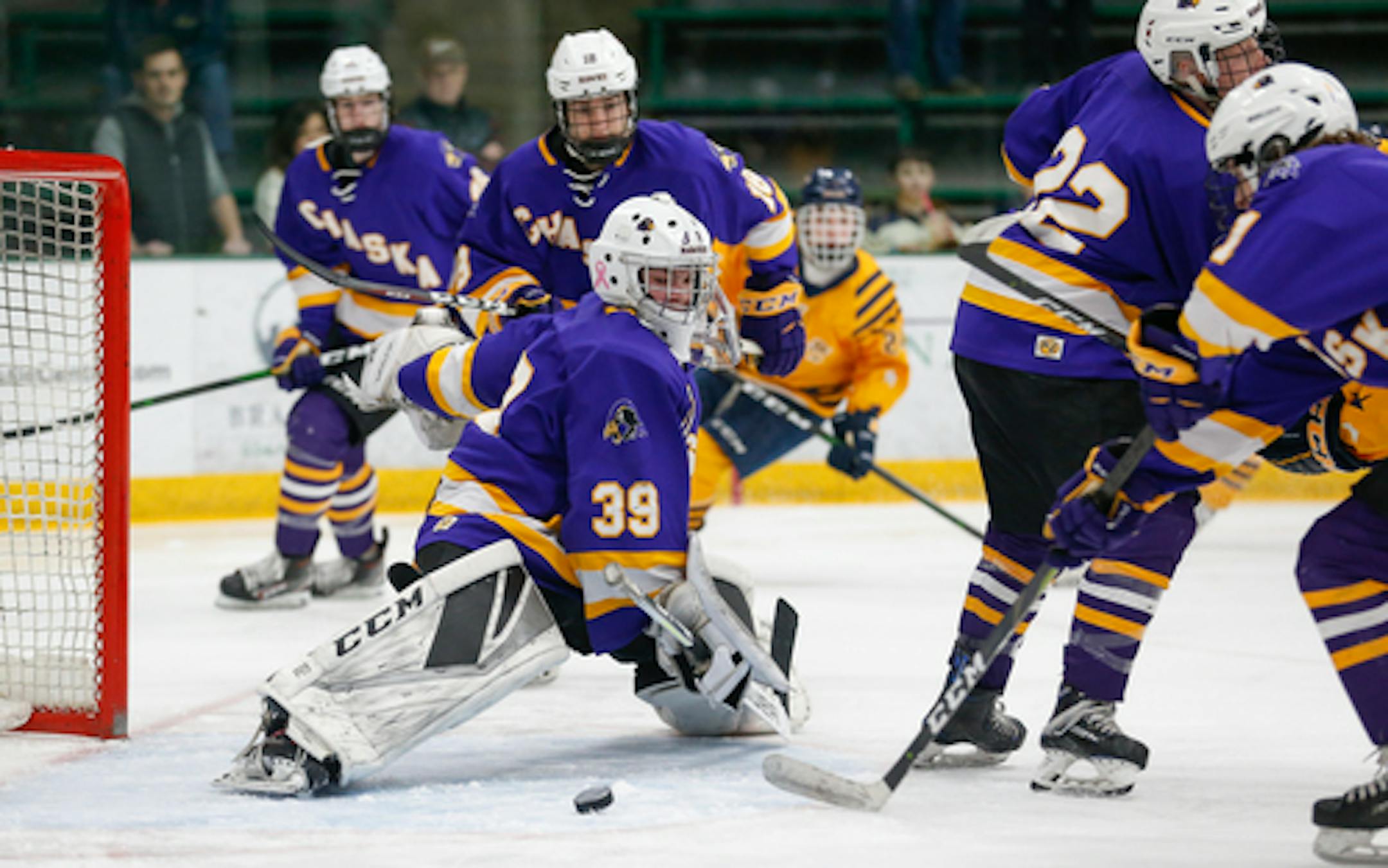 Chaska goalie Carter Wishart (39) lunges toward a loose puck as it slides across the crease during Saturday afternoon's game against Prior Lake. Wishart had 19 saves in the Hawks' 4-1 victory over the Lakers. Photo by Jeff Lawler, SportsEngine