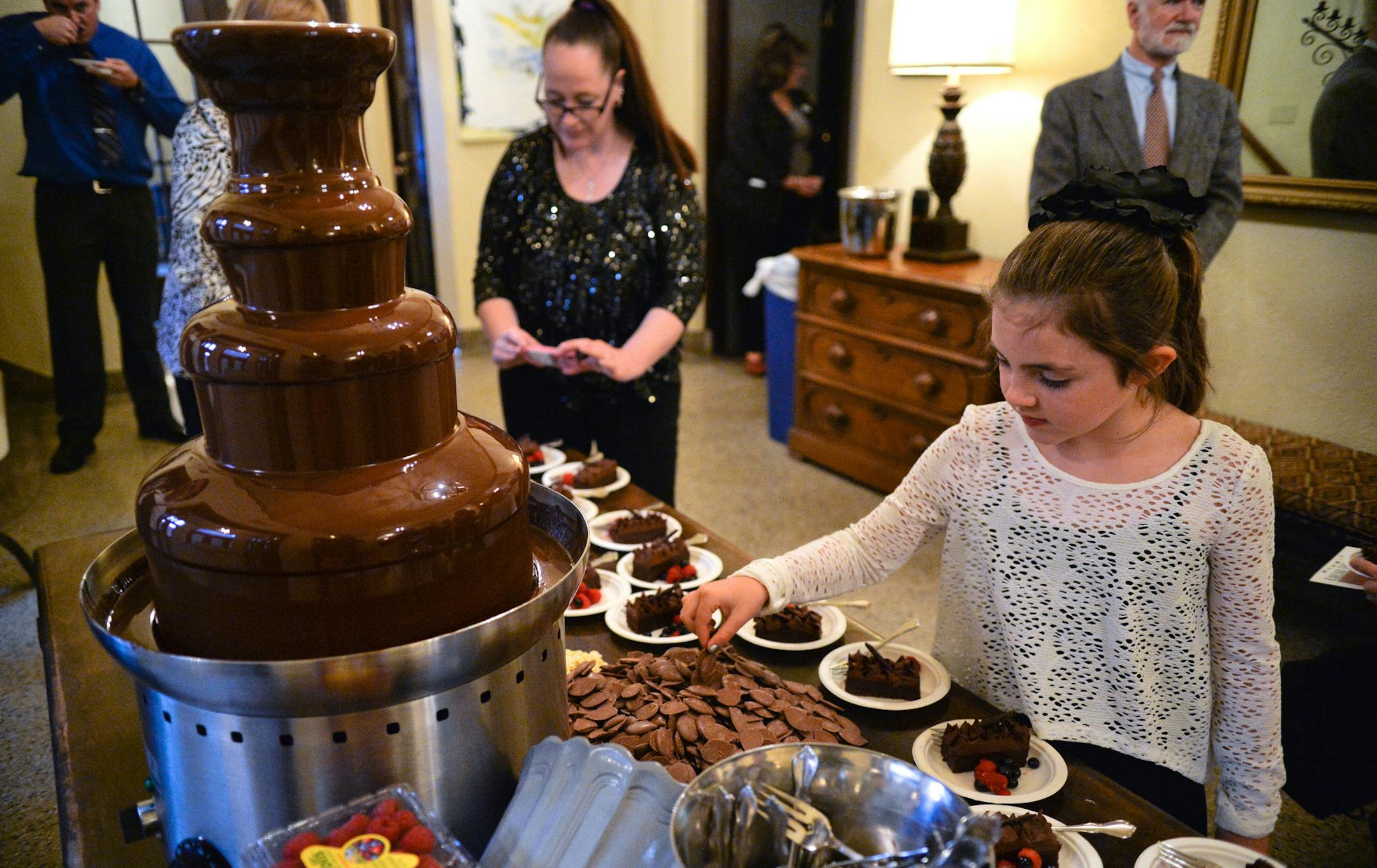 Guests enjoy a decadent chocolate dessert selection, complete with a chocolate fountain. ] (SPECIAL TO THE STAR TRIBUNE/BRE McGEE)