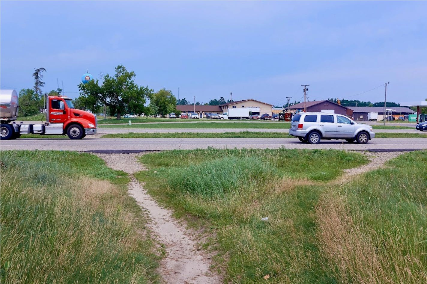 Multiple pedestrian footpaths cross a stretch of Hwy. 2 in Cass Lake, Minn.