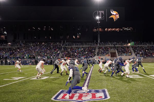 Eagan and Farmington played under the lights in the first high school football game at TCO Stadium in 2018.