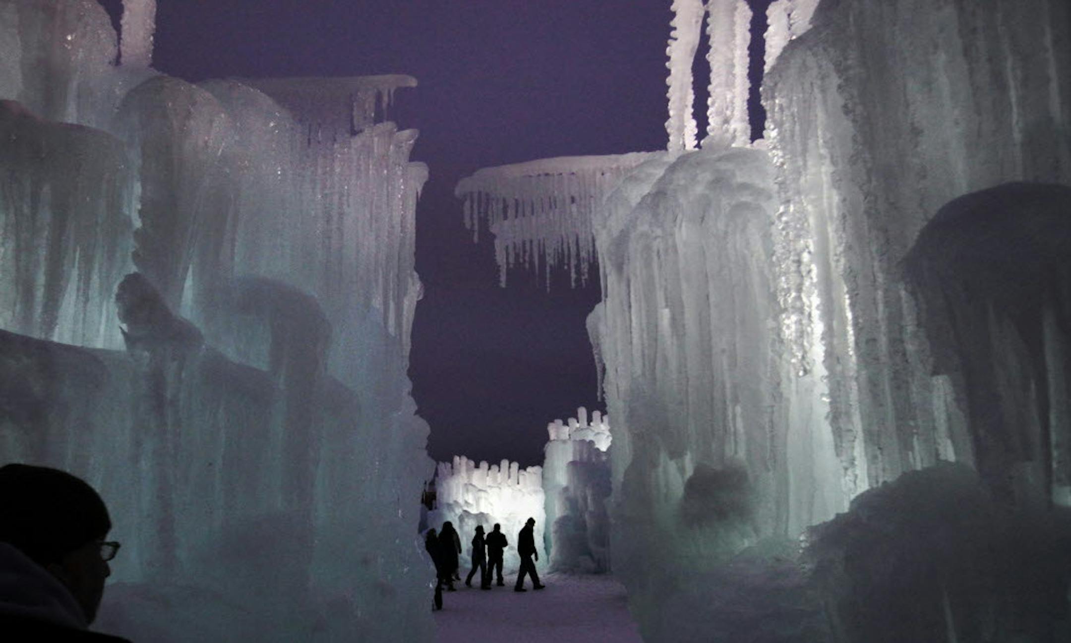 File photo by David Joles of the Star Tribune of visitors at the ice castles Jan. 1, 2013 at the Mall of America parking lot in Bloomington. In 2014-2015, Ice Castles are coming to Eden Prairie's Miller Park.