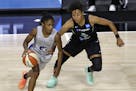 Lynx guard Crystal Dangerfield, left, moves around New York Liberty guard Layshia Clarendon during a game last month.