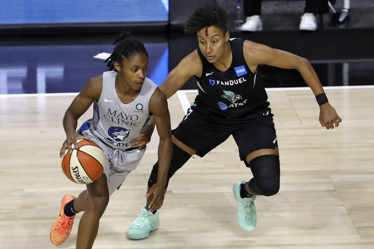 Lynx guard Crystal Dangerfield, left, moves around New York Liberty guard Layshia Clarendon during a game last month.