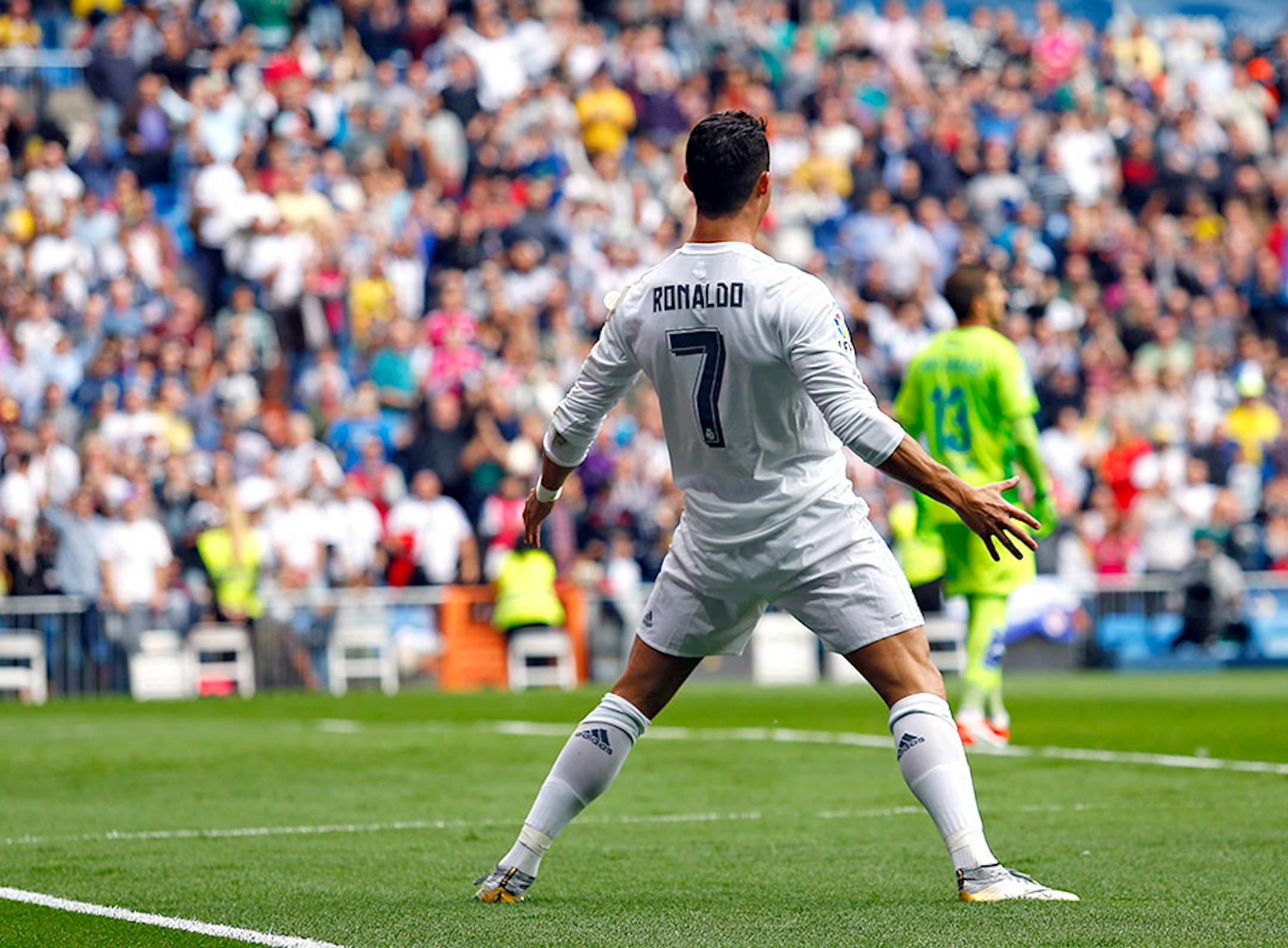 Real Madrid's Cristiano Ronaldo celebrates after scoring his team's second goal against Las Palmas during the Spanish La Liga soccer match between Real Madrid and Las Palmas at the Santiago Bernabeu stadium in Madrid, Saturday, Oct. 31, 2015.