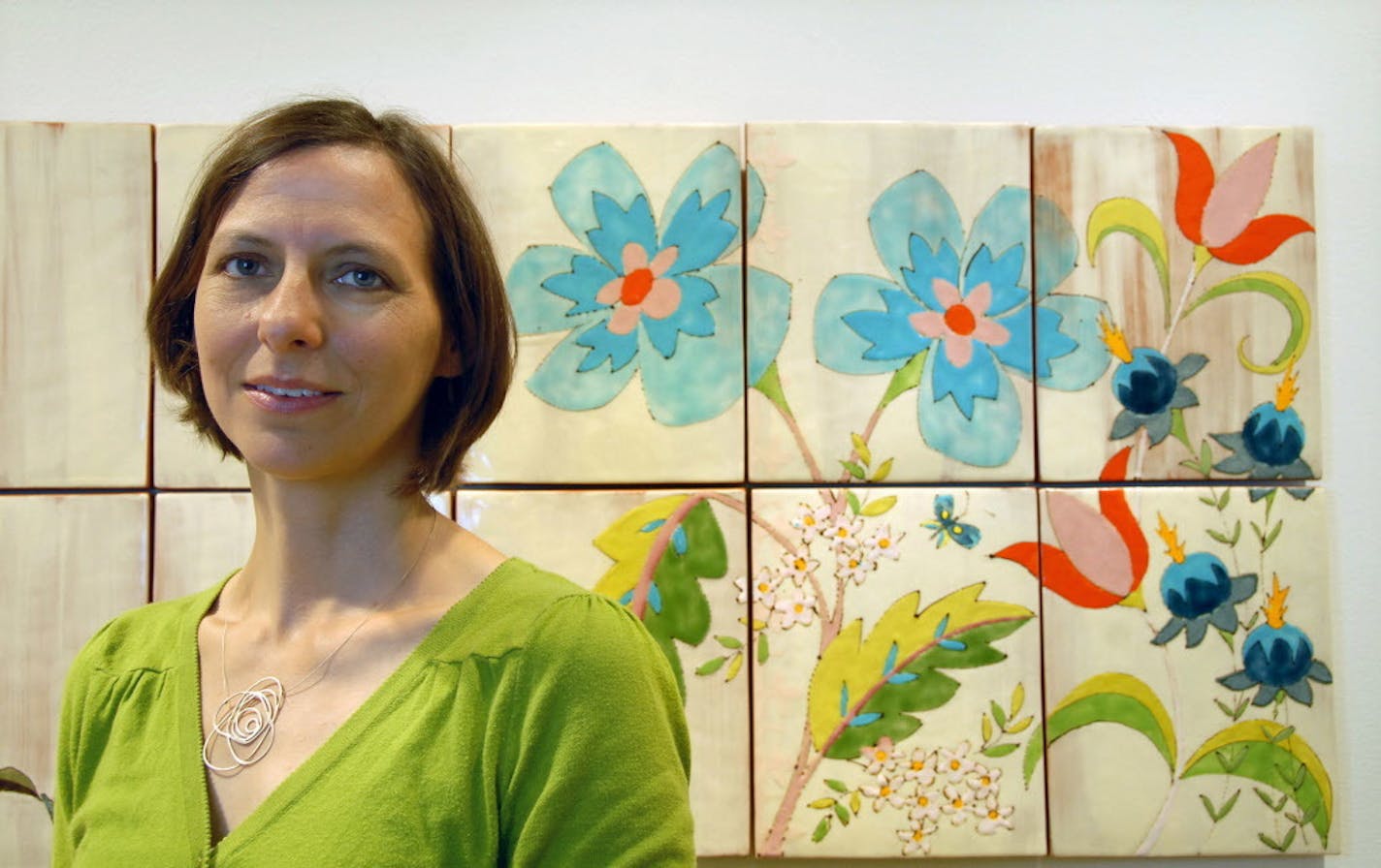 Ceramic artist Ursula Hargens stood next to her "Wallflower (Invasive Species)" installation in Christensen Center Art Gallery at Augsburg College.) ] Joey McLeister,Special to the Star Tribune,Minneapolis,MN August21,2012