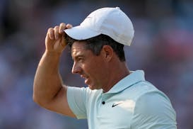 Rory McIlroy, of Northern Ireland, reacts after missing a putt on the 18th hole during the final round of the U.S. Open golf tournament Sunday, June 1