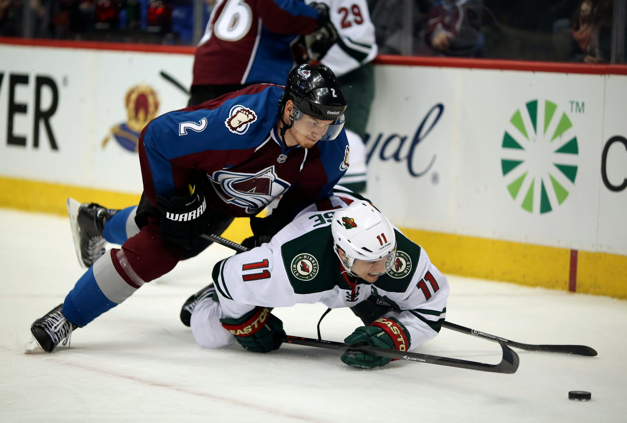 Minnesota Wild left wing Zach Parise was pinned down in the corner by Avalanche defenseman Nick Holden.
