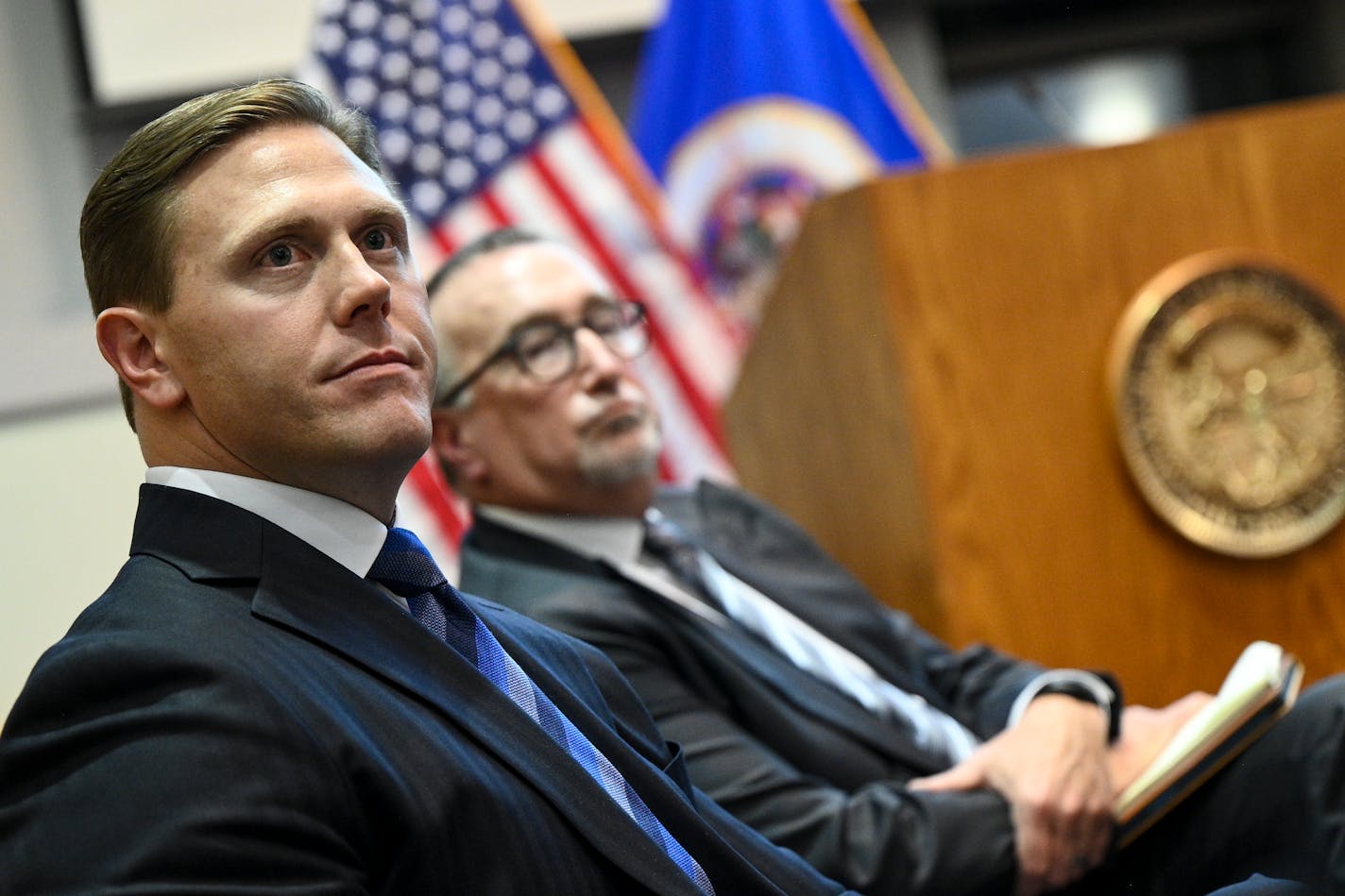 Sanford CEO Bill Gassen, left, and Fairview CEO James Hereford listen to public comments Tuesday, Jan. 10, 2023 at the Department of Revenue building in St. Paul, Minn.. Healthcare leaders, advocates and the general public weighed in on the Sanford-Fairview merger during a discussion hosted by the Minnesota Attorney General's office. ] AARON LAVINSKY • aaron.lavinsky@startribune.com