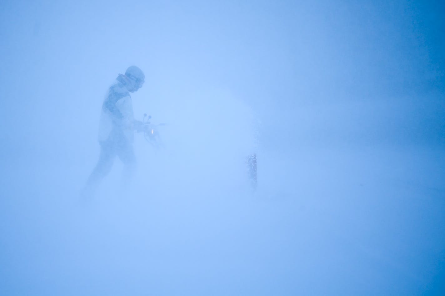 Tim Keefe uses a snow blower to clear his driveway during a snow storm, Wednesday, Dec. 23, 2020 in Robbinsdale, Minn. (Aaron Lavinsky/Star Tribune via AP)