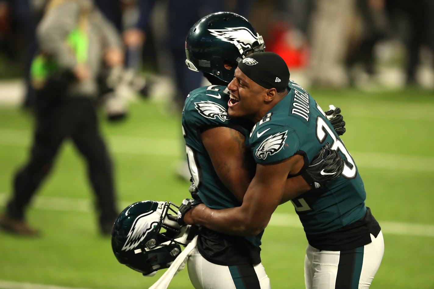 Eagles cornerback Jaylen Watkins, left, embraced cornerback Rasul Douglas at the end of the game after they won Super Bowl LII