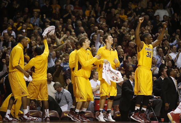 The Gophers bench celebrated as they maintained their lead in the last seconds of the game against then-No. 1 Indiana at Williams Arena.