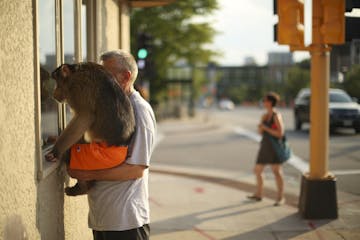 While the tour was looking at the Italian Edible Streetscape container outside Carbone's Pizza, Roy Carlson came along with his 18 year-old pigtail ma