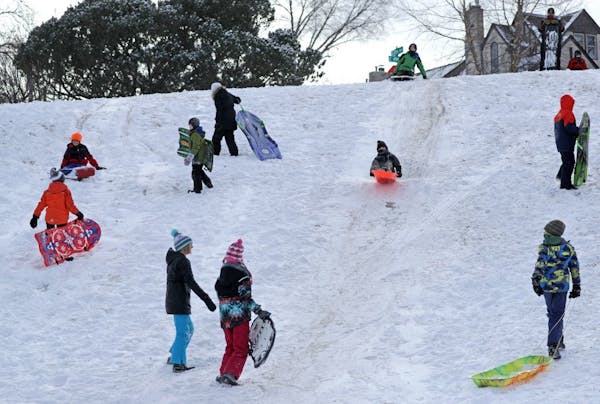 Nothing like a good old fashioned Snow Day to get kids outside. The hill along Minnehaha Creek near Cedar Ave. and 49th Street was a sledders paradise