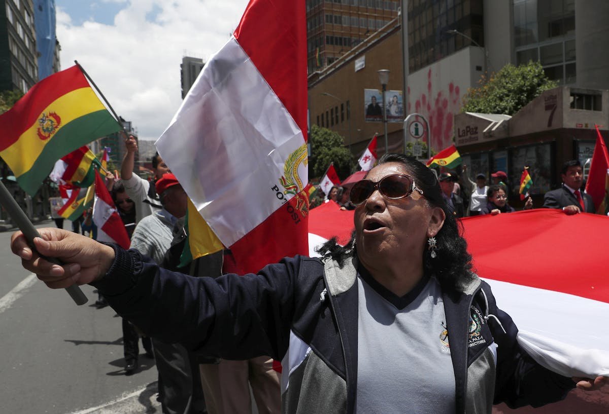 Anti-government protesters march against the reelection of President Evo Morales in La Paz, Bolivia, Sunday, Nov. 10, 2019. President Morales is calli