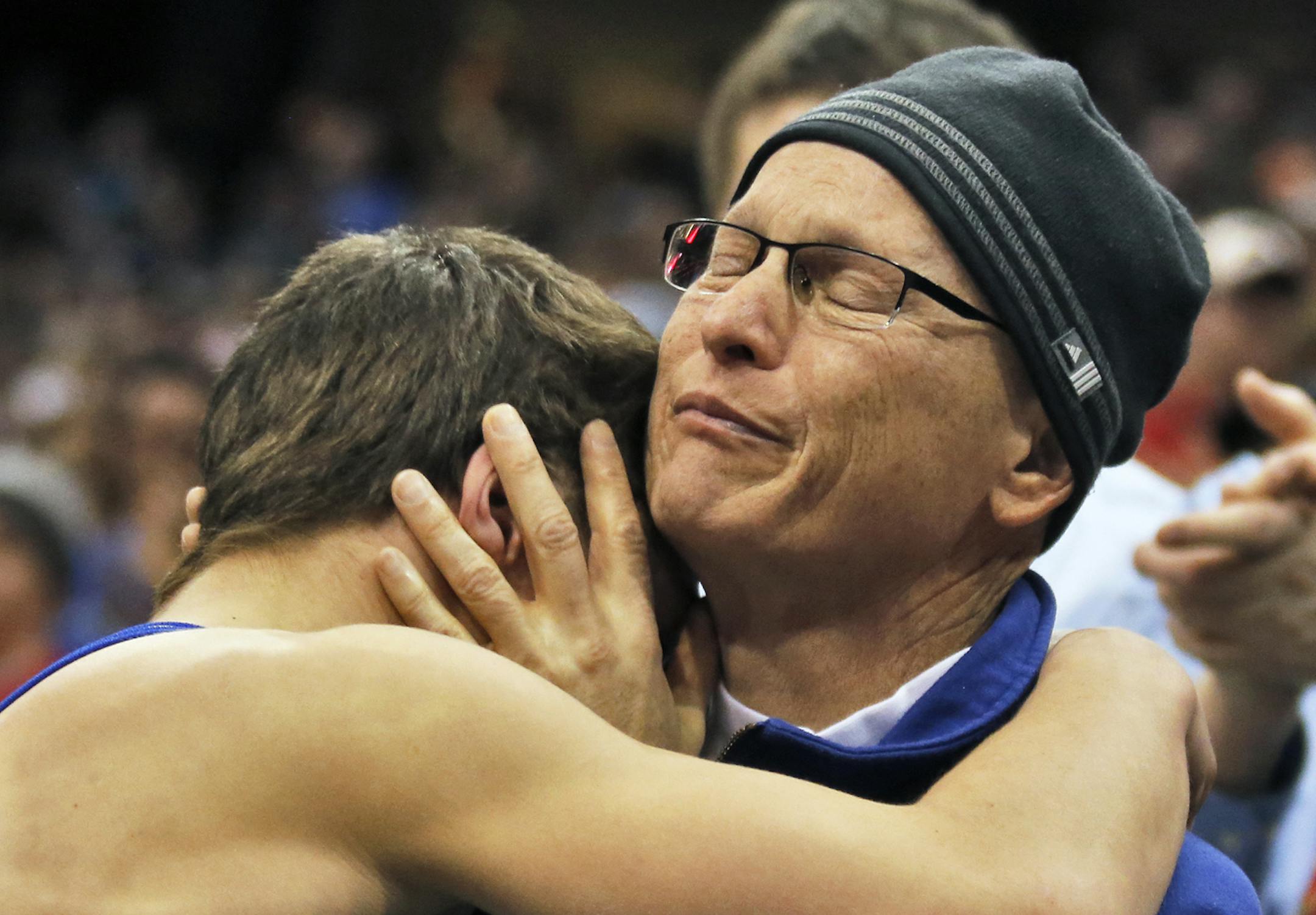 Mitchell McKee of St. Michael-Albertville hugged his dad Steve McKee after winning the 3A 120lb championship match. Steve McKee left a hospital bed where he is under going treatment for cancer to watch his son wrestle. [ Prep State Wrestling Individual Championships (MARLIN LEVISON/STARTRIBUNE(mlevison@startribune.com)