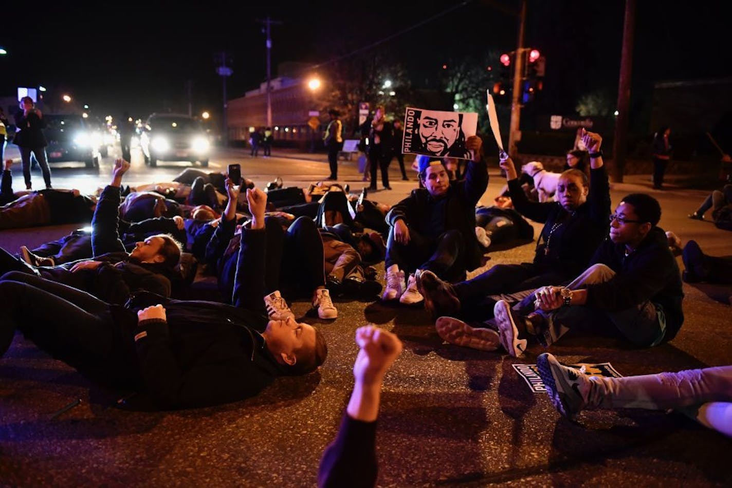 Protesters in St. Paul held a die-in at Marshall and Hamline avenues during a march Wednesday night for Philando Castile.