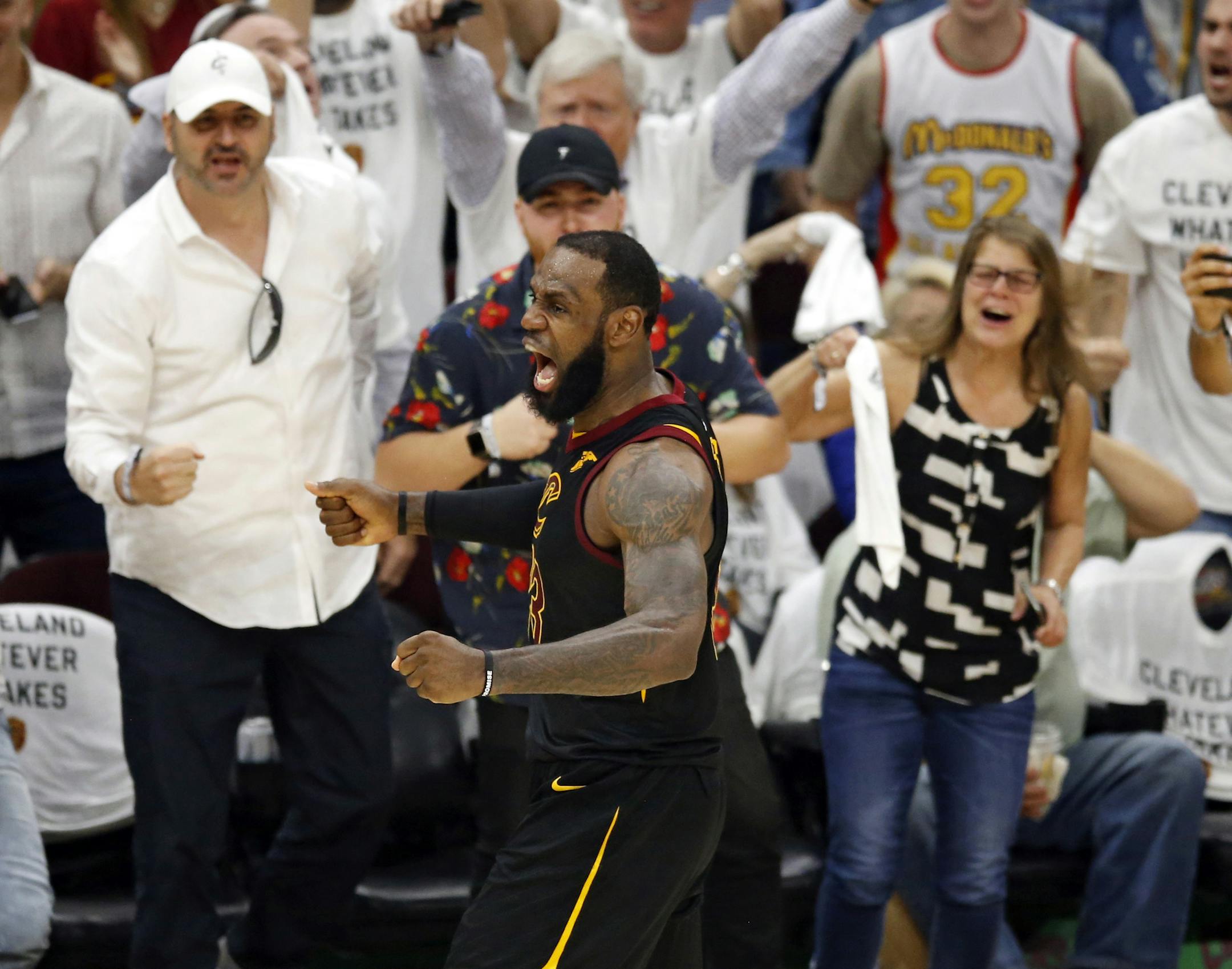 Cleveland Cavaliers' LeBron James reacts after making a 3point shot during the second half of Game 6 of the team's NBA basketball Eastern Conference finals against the Boston Celtics, Friday, May 25, 2018, in Cleveland. The Cavaliers won 109-99. (AP Photo/Ron Schwane)