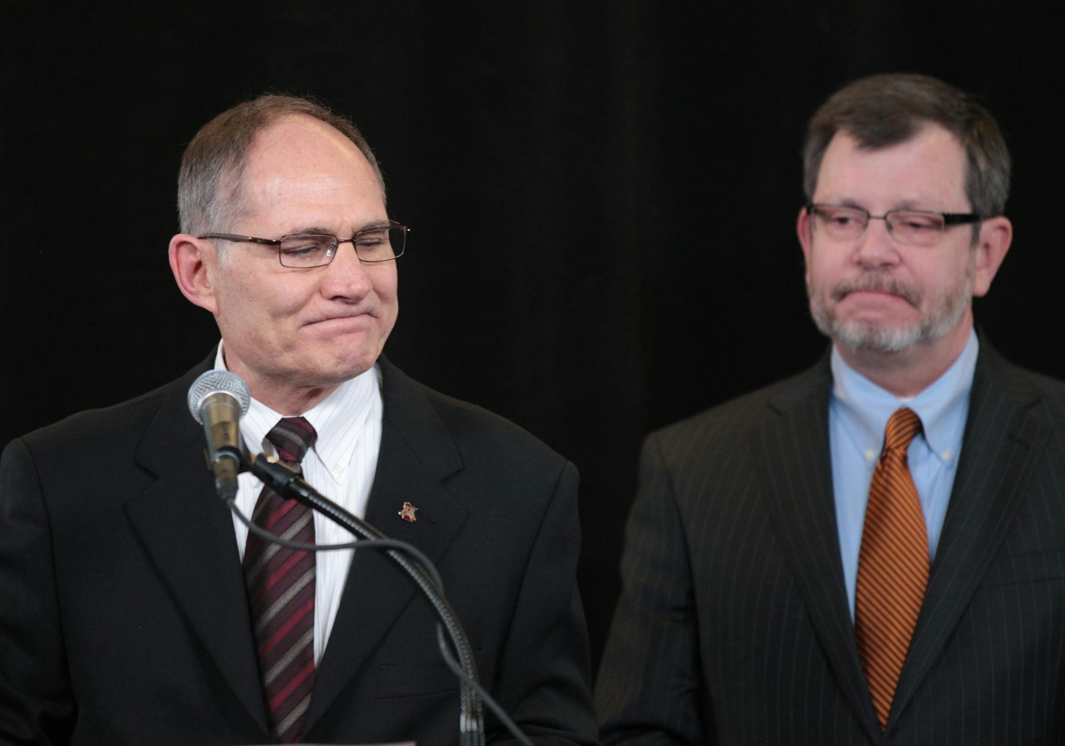 University of Minnesota Athletic Director Joel Maturi and President Eric Kaler.