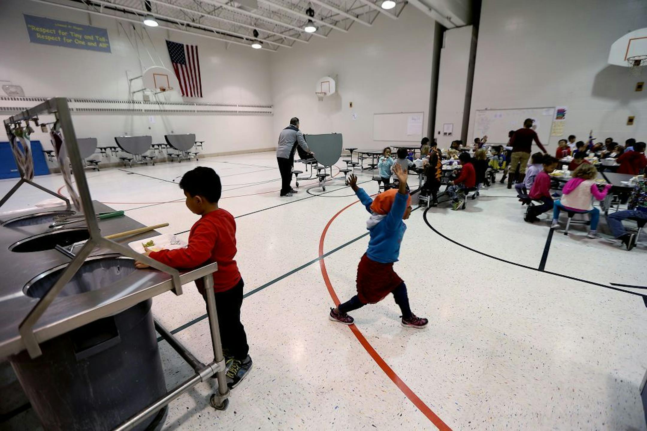 Linwood Monroe Arts Plus School students share a cafeteria with the school's gym and stage, Wednesday, December 21, 2016 in St. Paul, MN.